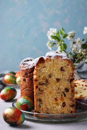 Easter cake Craffin and marble colorful eggs on a light blue background. Concept of the spring...