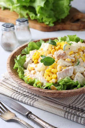 Salad with pineapple, baked chicken and corn on a plate of coconut. Closeupの写真素材