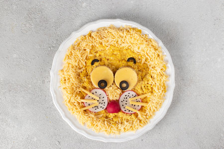 Fun food for kids breakfast - cute lion head made from scrambled eggs, cheese, radishes and olives...