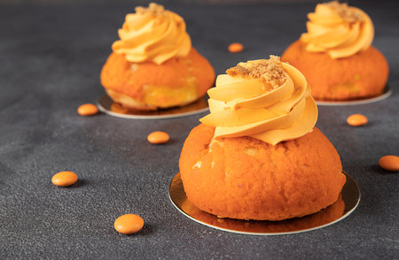 French cakes Chou of thin crispy choux pastry with a sweet shortcrust crust, mango and custard on...