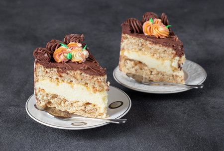 Two pieces of Kyiv cake on dark gray background, Closeup