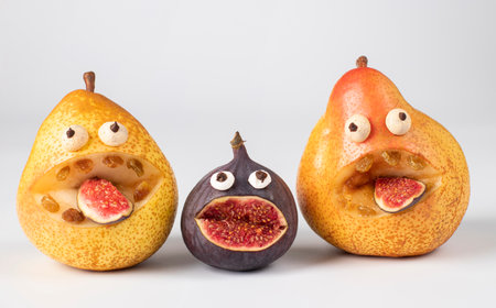 Spooky pears and fig monster for Halloween party on white background, Closeupの写真素材