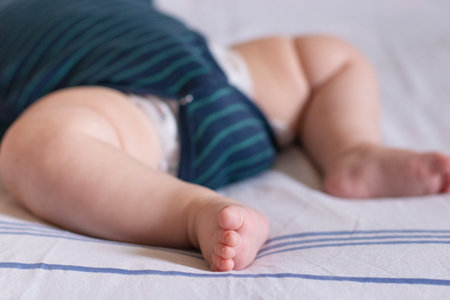 Legs of newborn baby in the crib. Concept of health childs dreamの写真素材