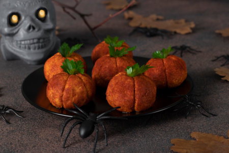 Pumpkins made of cheese and paprika for Halloween-style partyの写真素材
