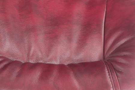 artificial leather of claret color as a backgroundの写真素材