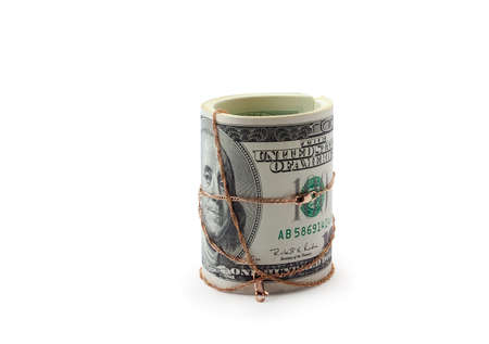 money of roll entwisted by gold on a white background isolatedの写真素材
