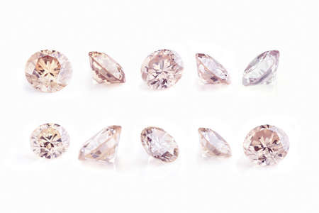 Collection of faceted diamonds in macro on a white backgroundの写真素材