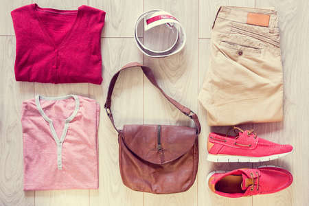 Set of men's clothes consist of jeans, sneakers, sweater, T-shirt, bag and beltの写真素材