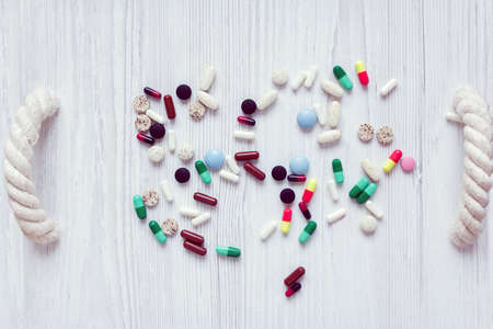 different and colorful pills on a white salverの写真素材