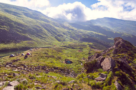 camp in the valley among the mountainsの写真素材