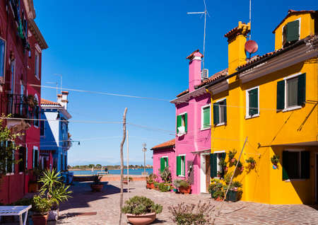 burano island with colorful houses and blue skyの写真素材