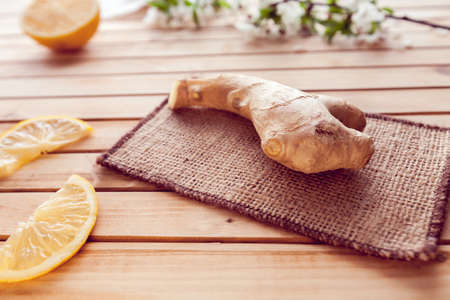 ginger and lemon slices on a wooden backgroundの写真素材