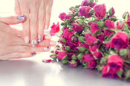 Skin care of a beautiful female hands with art nail manicure.の写真素材