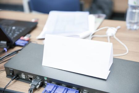 White Name Tag on Office Desk at Public Meetingの写真素材