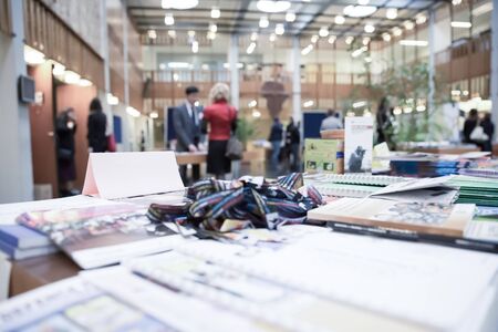 Light Pink Company Name Header Paper Tag on Exhibition Deskの写真素材