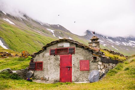 Mountain Stone Huts on Iconic Mont-Blanc Trail on a Cloudy Dayの写真素材