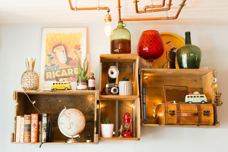 Interior Decoration with Wooden Boxes and Second Hand Objects with a Modern Square Copper Piping