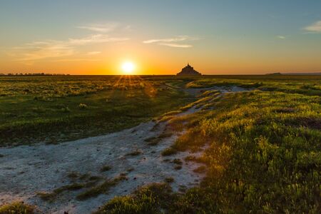 Mont Saint-Michel Bay in Normandy France at Sunsetの写真素材
