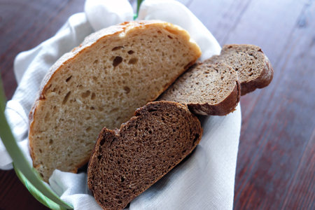 Basket with fresh white and black bread