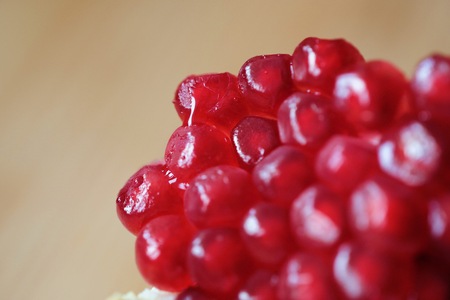 Red and juicy pomegranate grains close viewの写真素材
