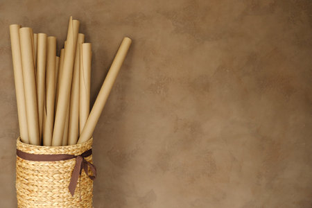 Wicker basket with rolls of paper in the officeの写真素材