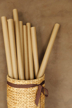 Wicker basket with rolls of paper in the officeの写真素材