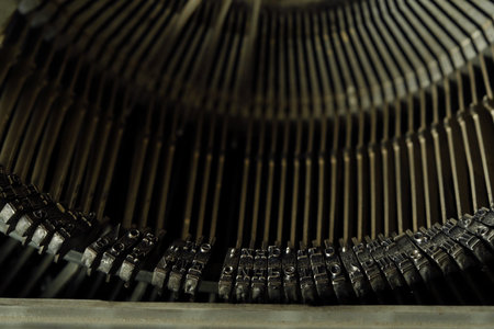 Old black typewriter with round keys