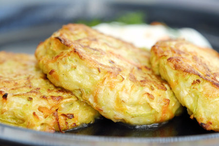 Vegetable patties with sour cream and caviar