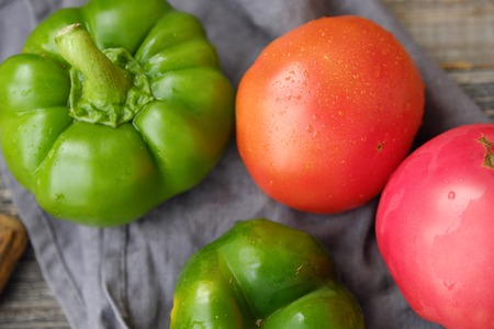 Fresh tasty vegetables on a wooden background viewの写真素材
