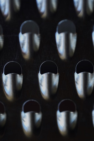 Beautiful iron the patterns on a vintage graterの写真素材