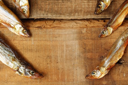 Dried fish with salt on a wooden backgroundの写真素材