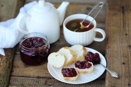 Delicious Breakfast with tea and jam on the tableの写真素材