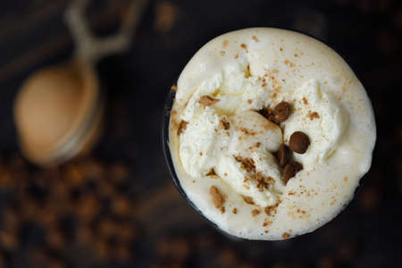 Delicious black coffee with ice cream on the tableの写真素材