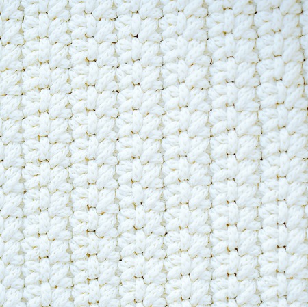 Beautiful white braided fabric Christmas ornament backgroundの写真素材