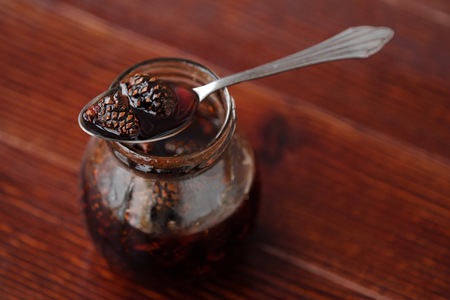 Delicious jam with the little pine conesの写真素材