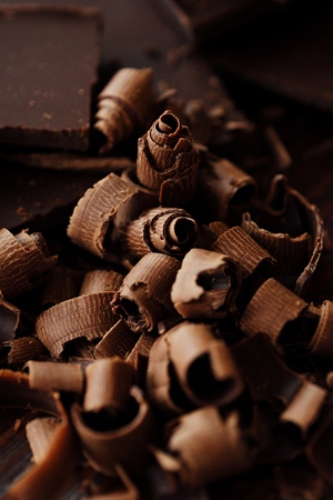 Delicious dark chocolate on a brown backgroundの写真素材
