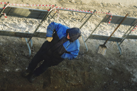 Working men in the form of standing around a sand pit