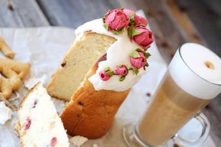Easter cake with roses and coffee on the table