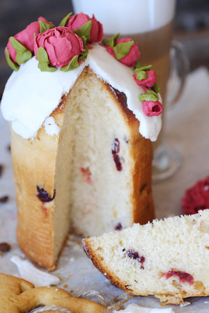 Easter cake with roses and coffee on the table