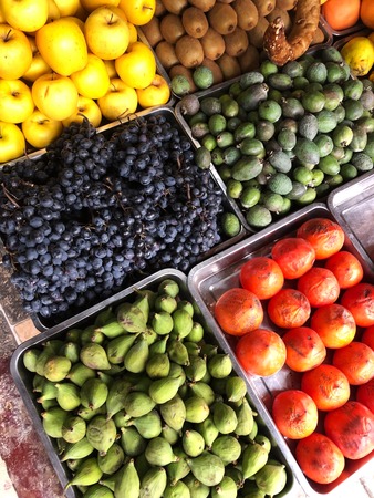 The grapes figs and persimmons in the marketの写真素材