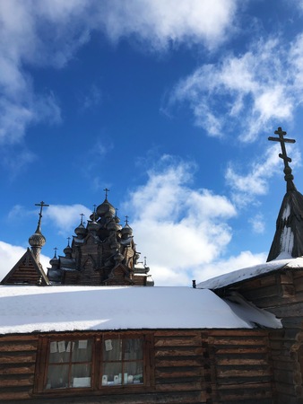 Beautiful wooden church in the village of winterの写真素材