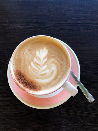 Delicious cappuccino with cinnamon in the cafe