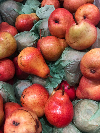 Fresh red pears on the market view