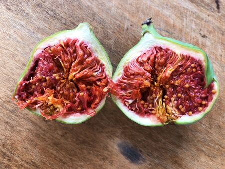 Delicious fruit green figs on wooden tableの写真素材
