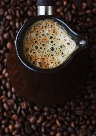 Fresh and tasty coffee in the Turka and coffee beansの写真素材