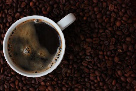 Coffee beans and coffee Americano on the tableの写真素材