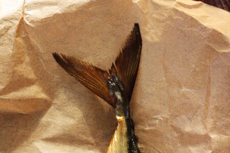 Delicious golden fish on the table close upの写真素材