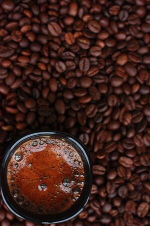 Delicious fresh coffee in a black mugの写真素材