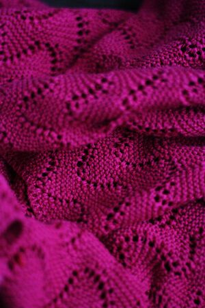 Beautiful knitted pink sweater close up viewの写真素材