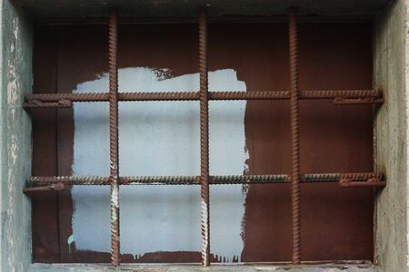 Brown background with metal mesh close up viewの写真素材